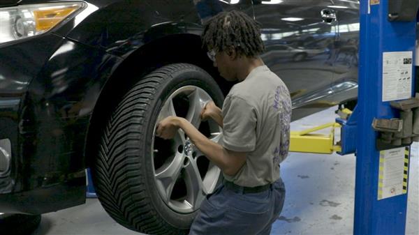 Student changing tire